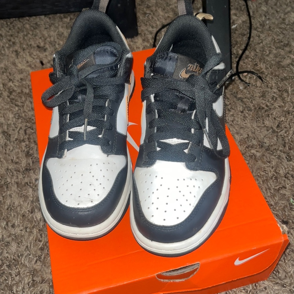 White and black and gold Dunks
